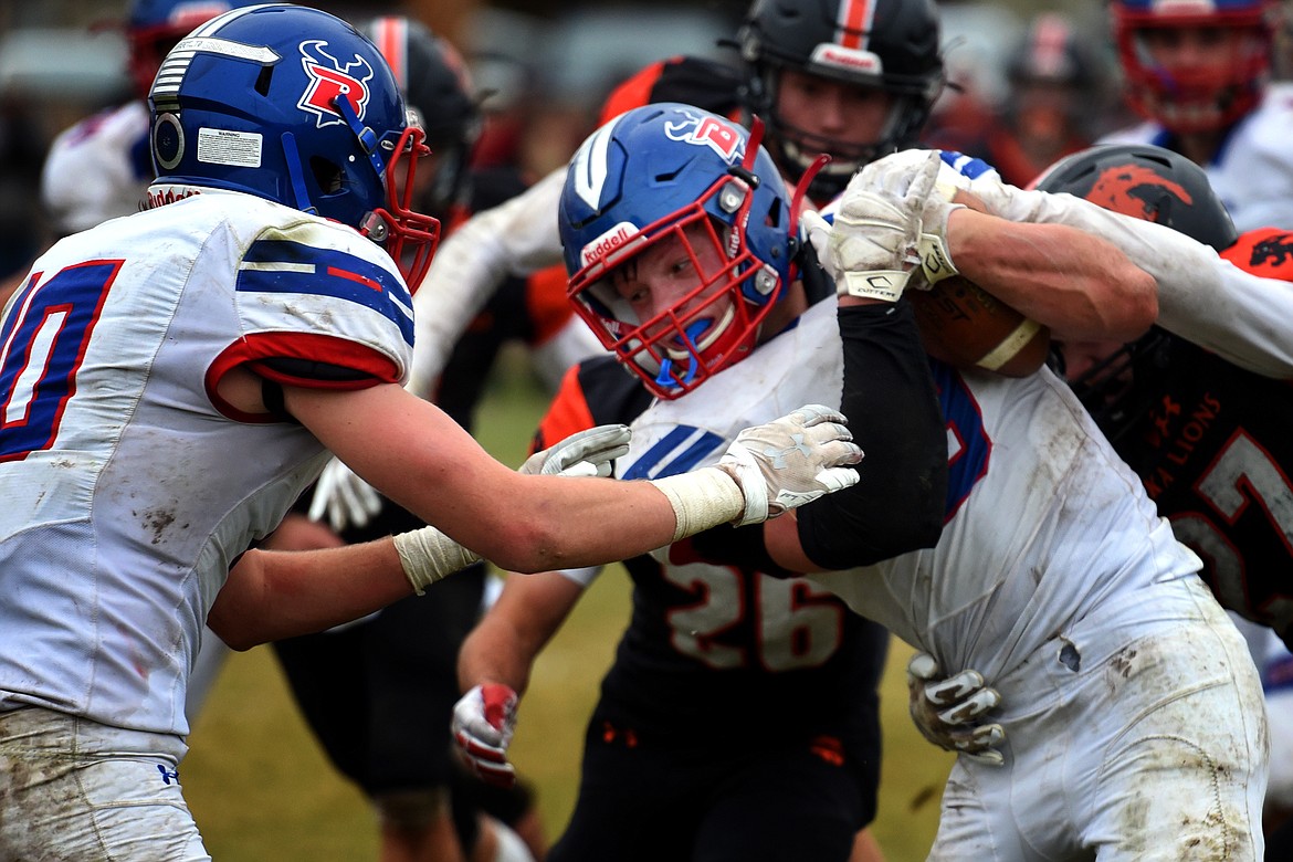 Bigfork running back Levi Taylor fights for extra yards in the fourth quarter of the Vikings 7-3 win at Eureka in the Class B state semifinals Saturday. (Jeremy Weber/Daily Inter Lake)