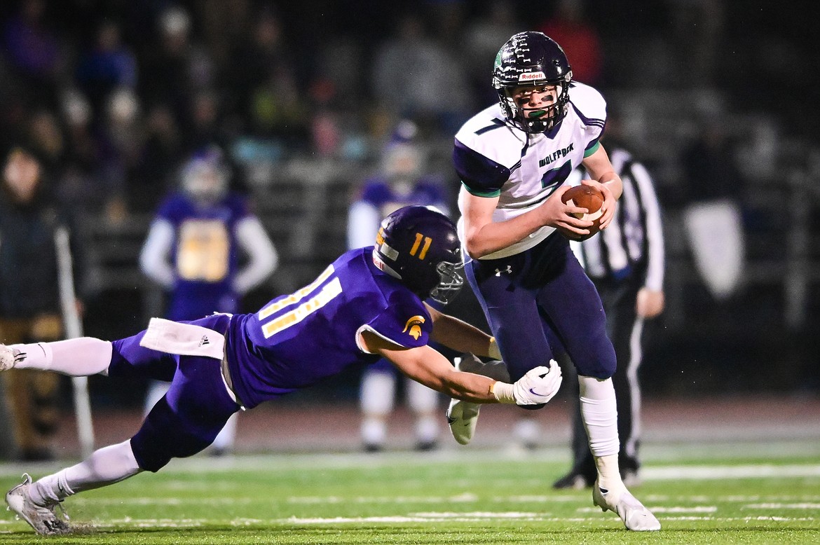 Glacier quarterback Gage Sliter (7) is sacked by Missoula Sentinel defensive lineman Zac Crews (11) in the third quarter at MCPS Stadium in Missoula on Friday, Nov. 12. (Casey Kreider/Daily Inter Lake)