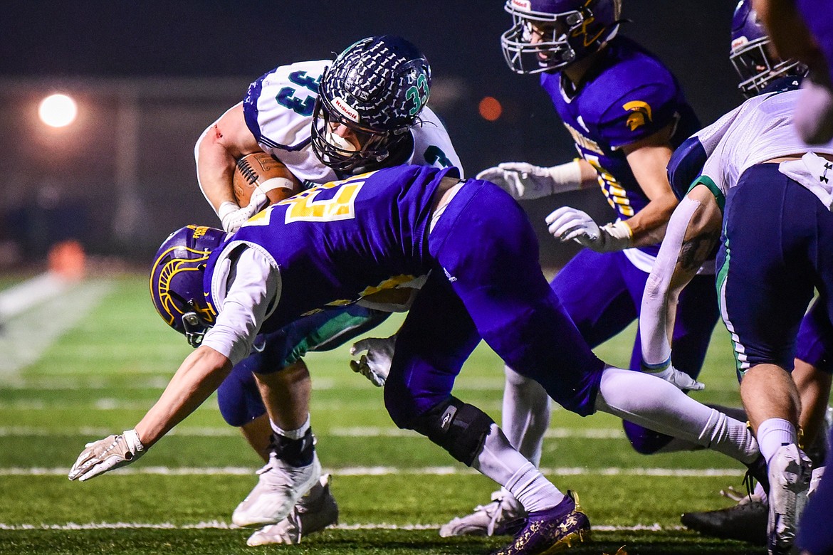 Glacier running back Jake Rendina (33) is brought down on a run in the first quarter against Missoula Sentinel at MCPS Stadium in Missoula on Friday, Nov. 12. (Casey Kreider/Daily Inter Lake)
