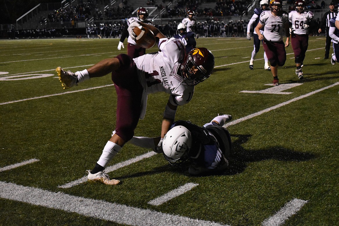 Moses Lake senior Sergio Guzman (11) runs out of bounds as he tries to avoid Gonzaga Prep players during the match on Friday.