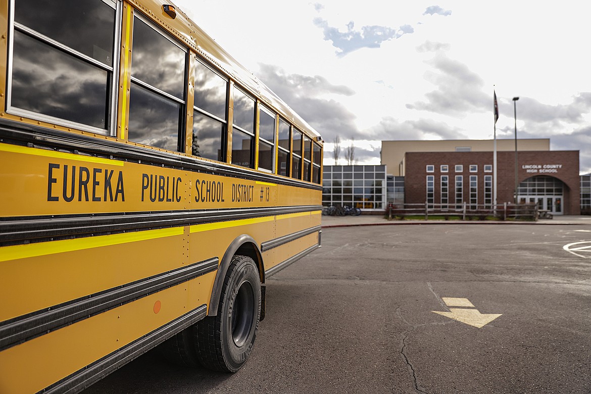 A school bus parked at Lincoln County High School in Eureka, Mont., on Nov. 5, 2021. Eureka Public Schools Superintendent Jim Mephan is retiring at the end of the school year because "the polarization in our community has made it very difficult to do what I believe is right for our students" with regard to COVID-19 precautions, and so has the lack of support from the school board. (Hunter D'Antuono/Flathead Beacon via AP)