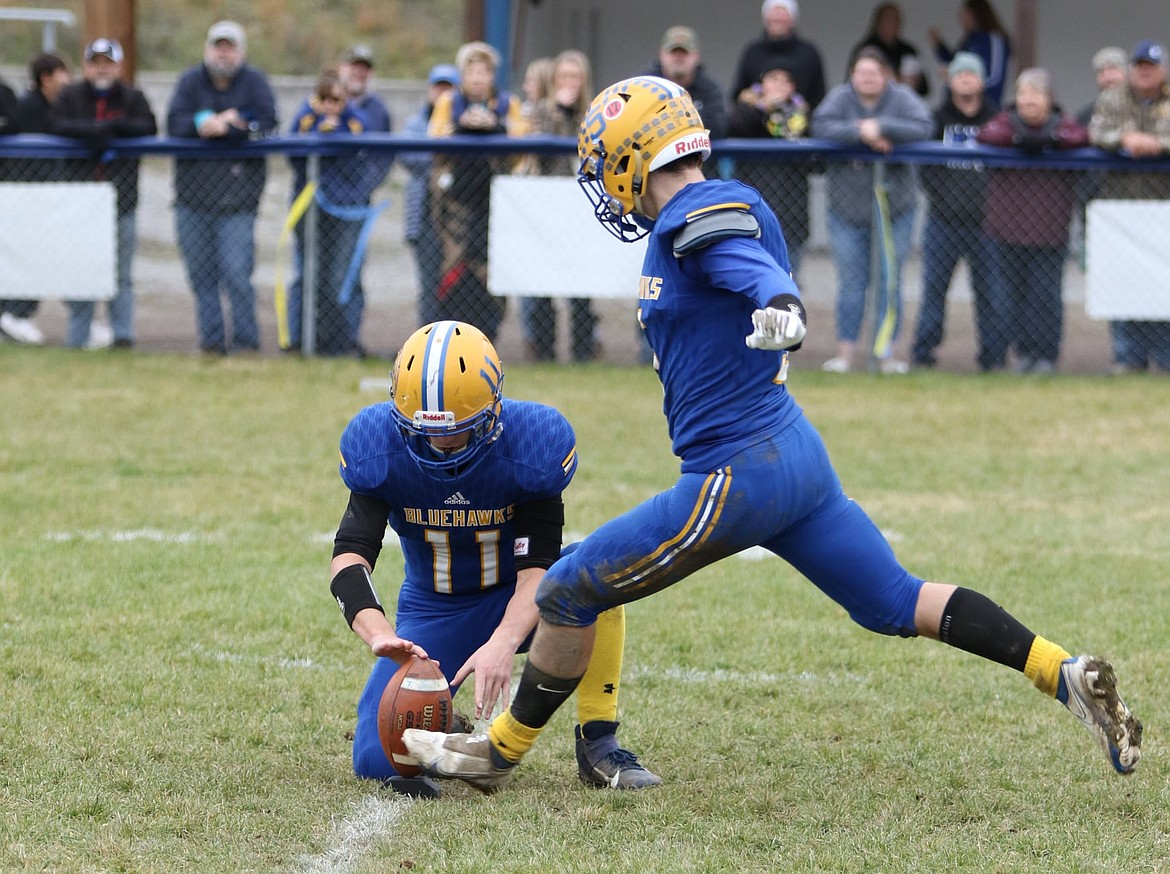 Thompson Falls kicker Nathan Schraeder boots one of three extra points in his teams' 41-16 win over Park City in last Saturday's 8-man semifinal playoff game. Schraeder scored three touchdowns to help the Blue Hawks to this Saturday's state title game. (Photo courtey John Hamilton)