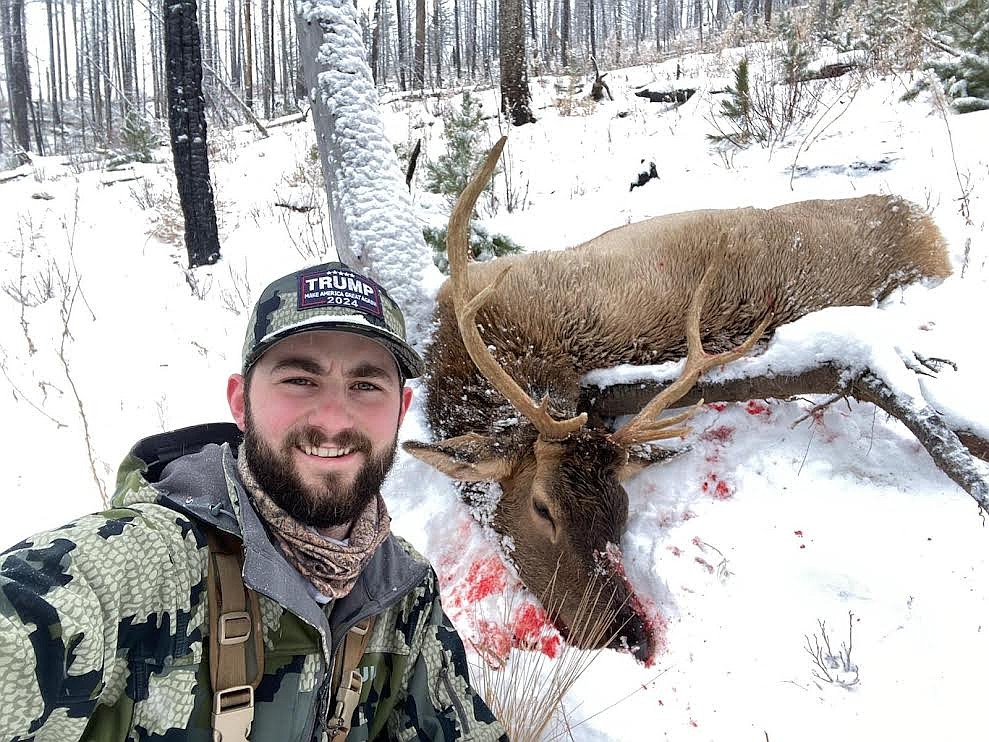 Wyatt O’Day, Garrett’s older brother, shows off a bull elk he bagged Thursday, Nov. 11, in the West End area.