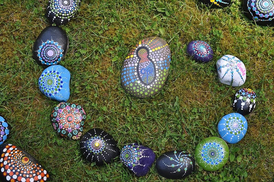 A collection of Mandala stones made during a previous art class of Kelly Morrison's is displayed in an artistic swirl in the grass. Participants made their own Mandala stones during a painting class on Sunday, Nov. 14, at the St. Regis Community Center. (Photo courtesy Kelly Morrison)