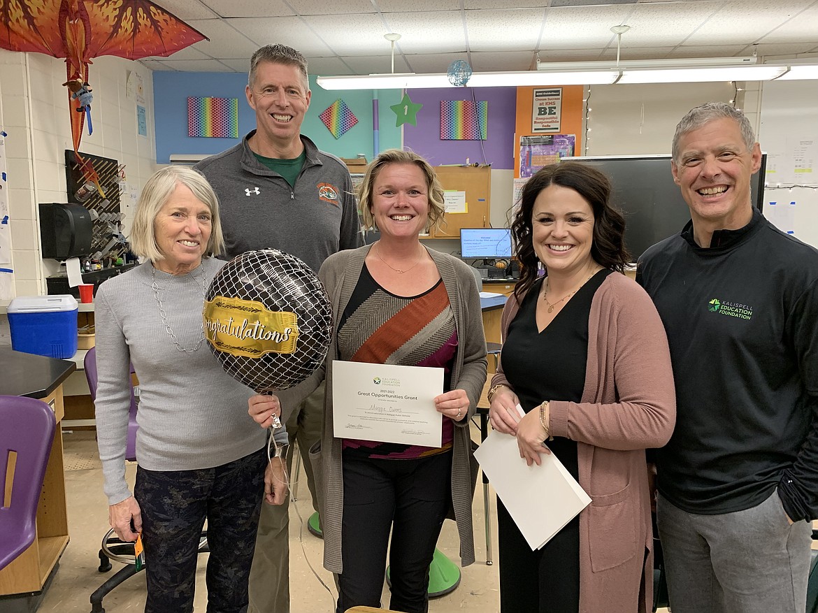 The Kalispell Education Foundation (KEA) awards Kalispell Middle School science teacher Maggie Owens with a Great Ideas grant for the purchase of science, technology, engineering and math materials to teach electricity and magnetism. The grant was one of 19 awarded to Kalispell Public Schools staff. Pictured left to right, KEA board member Carol Santa, Kalispell Middle School principal Tryg Johnson, Owens, KEA board president Jessica Hanson and board treasurer Jevon Clark.