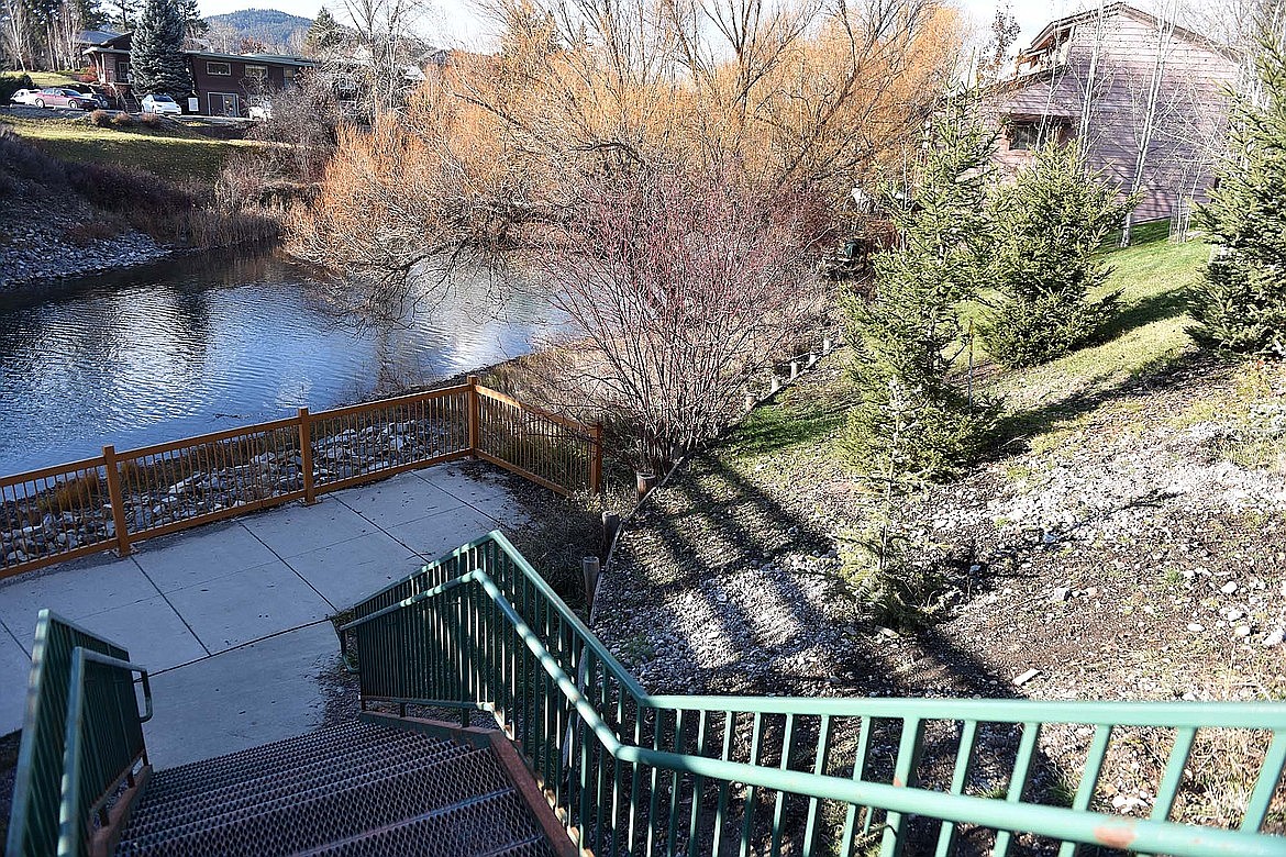 The city of Whitefish's bike path along the Whitefish River stops just under the U.S. 93 bridge where steps lead up to Miles Avenue. Trail users have to follow Miles Avenue north before being able to connect back with the trail. (Heidi Desch/Whitefish Pilot)