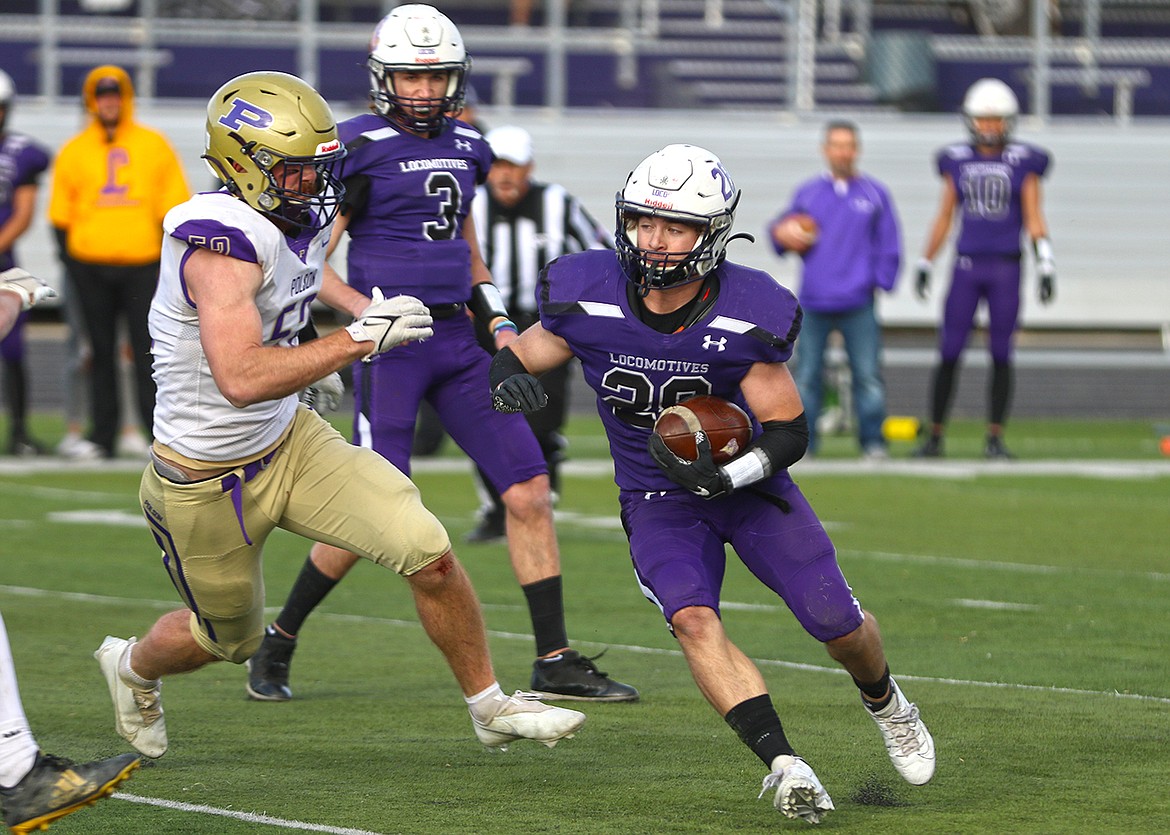 Polson's Braunson Henriksen chases down Laurel running back Beau Dantic. (Courtesy of Bob Gunderson)