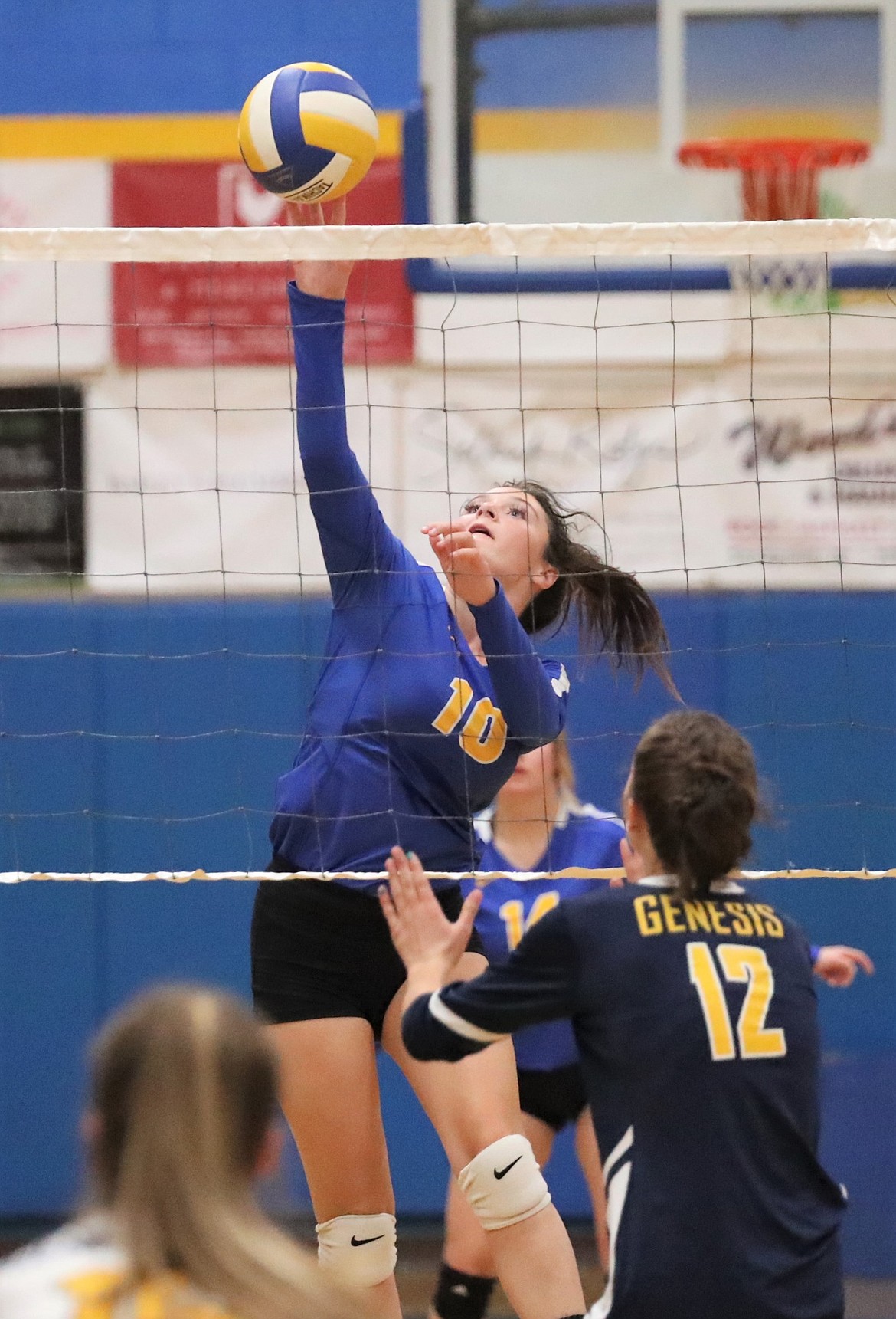 Senior Caiya Yanik rises up for a kill during a match against Genesis Prep on Sept. 16.