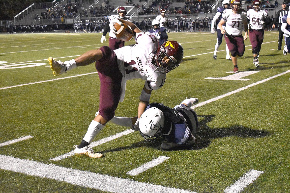 Moses Lake senior Sergio Guzman (11) runs out of bounds as he tries to avoid Gonzaga Prep players Friday.