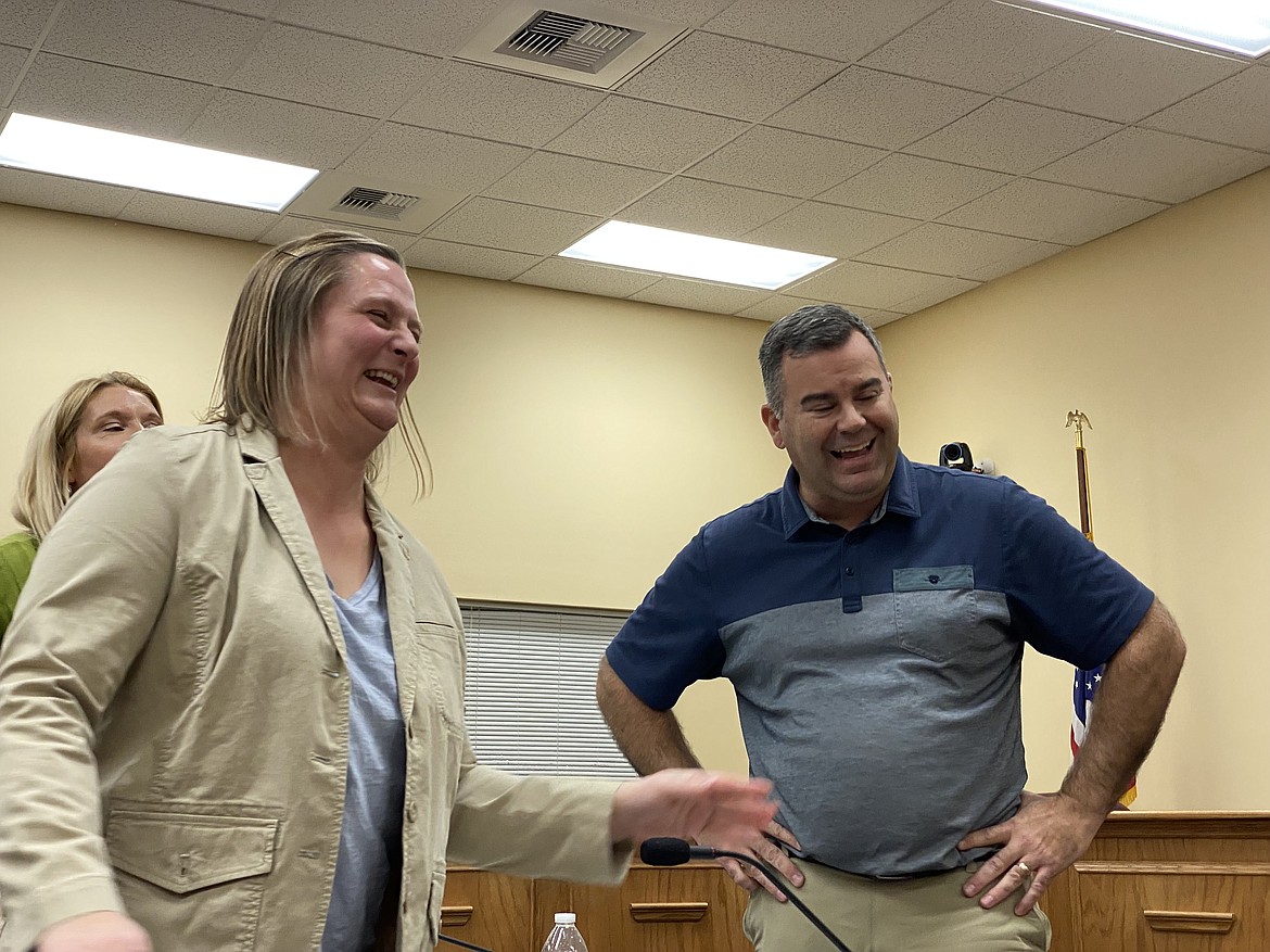 Newly-appointed Coeur d'Alene School District Trustee Heather Tenbrink and sitting Zone 2 Trustee Casey Morrisroe share a laugh after interviews Monday night. (MADISON HARDY/Press)