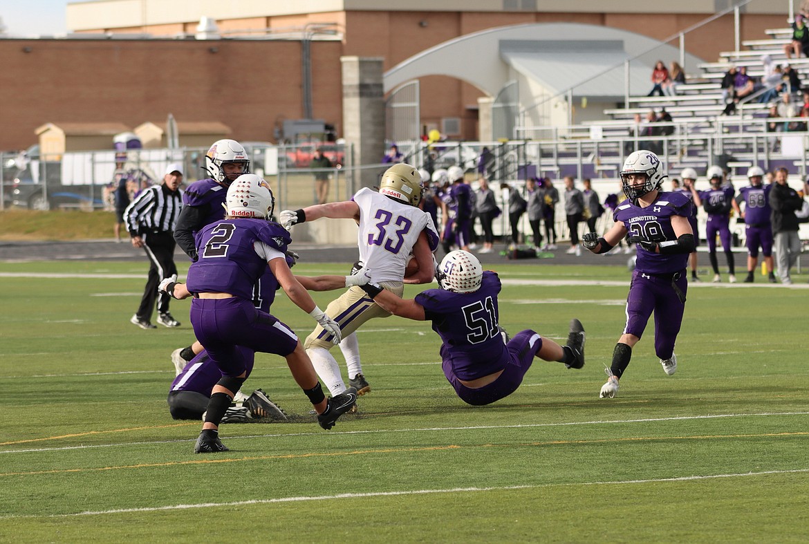 Laurel defenders try to take down Pirates running back Keyen Nash. (Courtesy of Niki Graham)