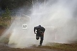 Poland uses water cannon against migrants at Belarus border