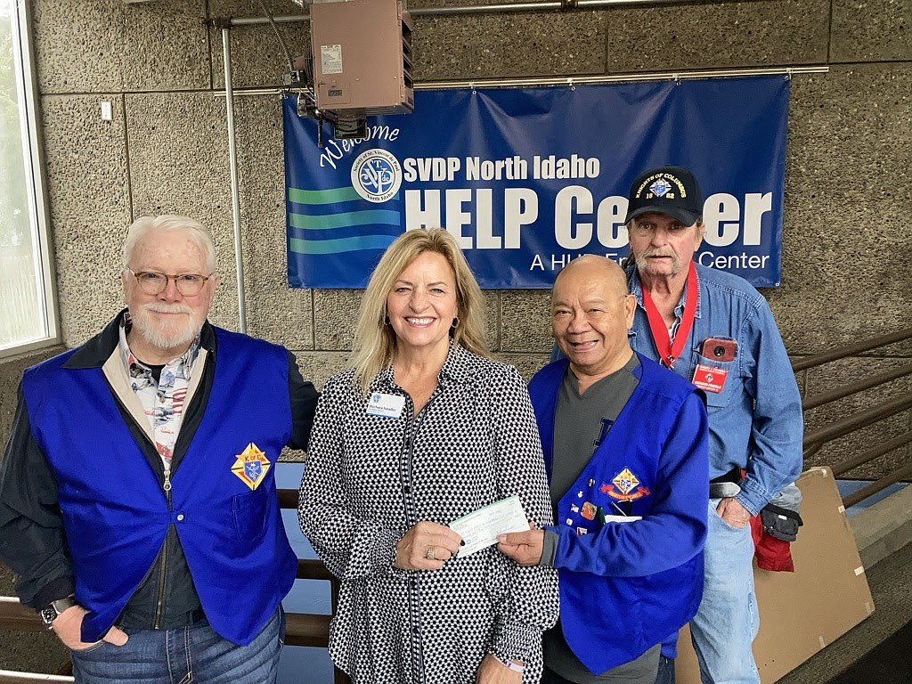 Photo courtesy of Jim Burkhardt
The Knights of Columbus Post Falls Council 12560 donated $1,000 to the St. Vincent de Paul Warming Center in Post Falls. When the outside temperature drops to 28 degrees or lower, the Center opens its doors to up to 40 homeless men, women and children. From left: Knight Mike Mackin, Development Director Barbara Smiley, Knight Bob Santos and Knights State Council District 10 Deputy Rich Freedle. This was the Knights' last donation of the fall. They plan to donate another $9,000 next spring.