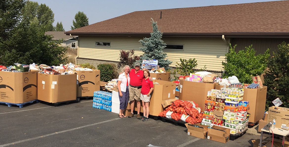 Attendees of the 2018 Center Target Sports Customer Appreciation event donated 25,000 pounds of food to local food banks. From left: founders Peggy and Ed Santos and Deb Behary, manager.