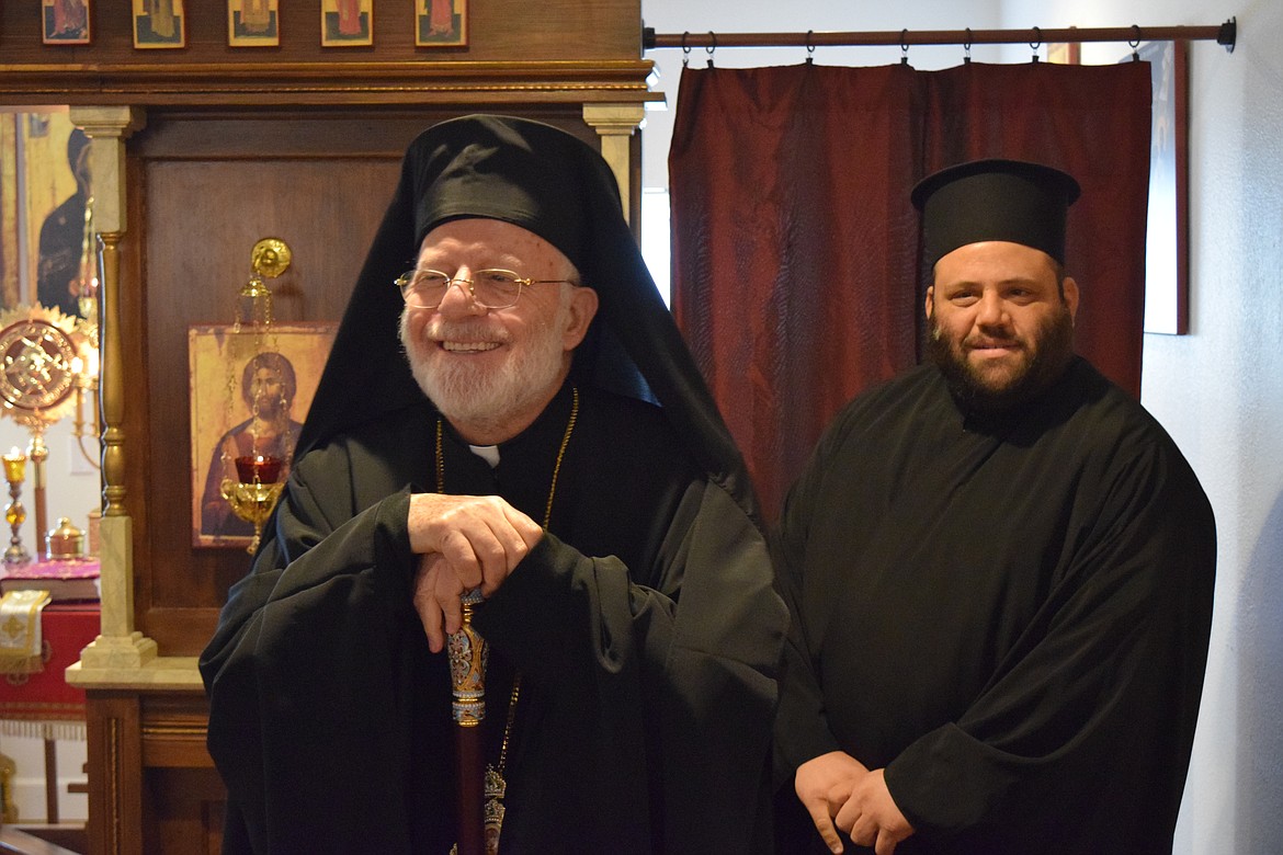 Metropolitan Joseph, the archbishop of the Antiochian Orthodox Christian Archdiocese of North America, with Father Michael Habib of St. Ignatius of Antioch Orthodox Christian Church in Twin Falls, Idaho, leans on his crozier as he greets a dozen or so parishioners at the Moses Lake Orthodox Fellowship Chapel during a short visit Friday. The metropolitan is also the bishop in charge of the Antiochian Church’s western U.S. diocese.