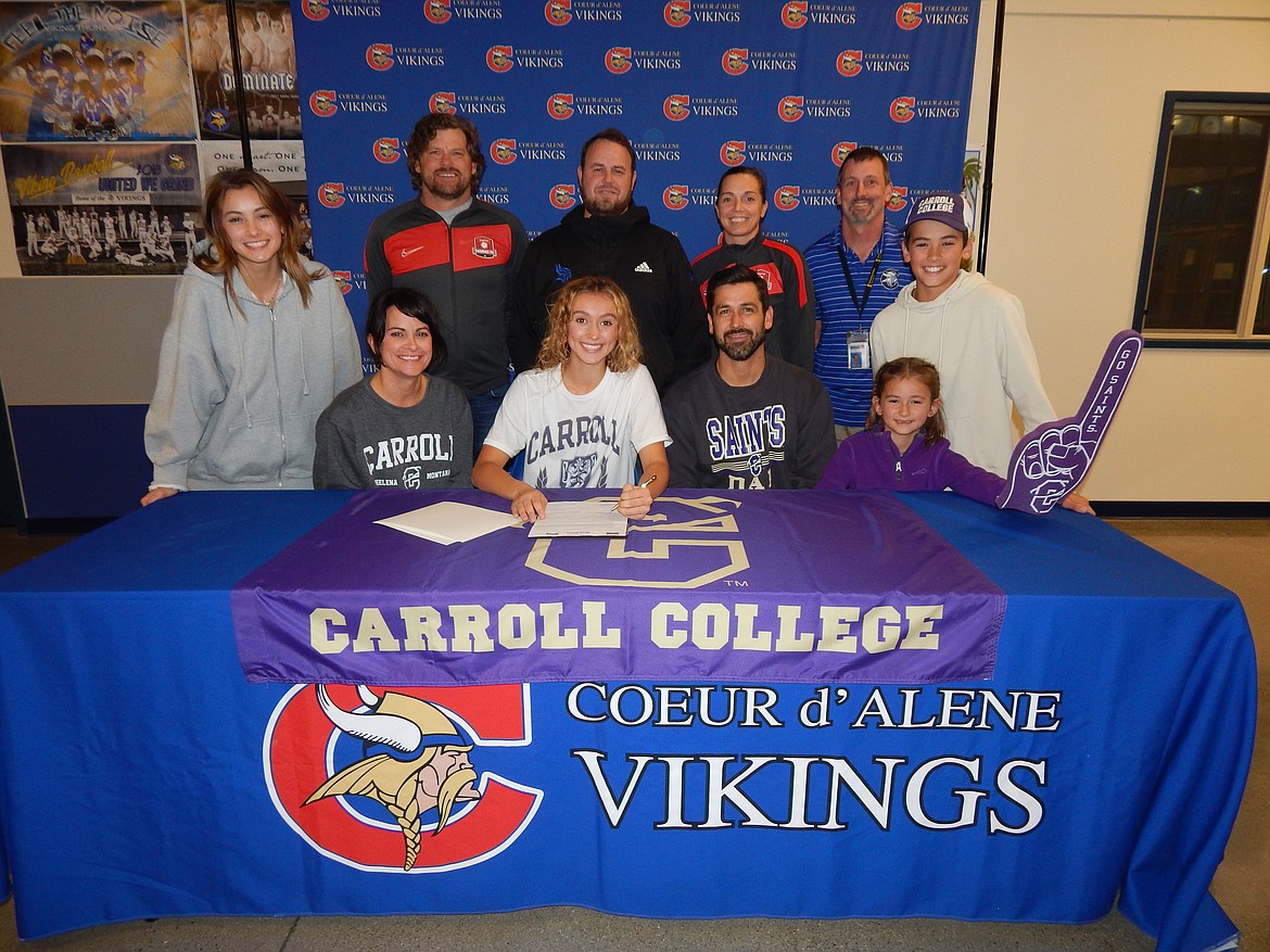 Courtesy photo
Coeur d'Alene High senior Myah Rietze recently signed a letter of intent to play soccer at NAIA Carroll College in Helena, Mont. Seated from left are Kristi Rietze (mom), Myah Rietze, Aaron Rietze (dad) and Audrey Rietze (sister); and standing from left, Elliana Rietze, sister; Julio Morales, club soccer coach; Andy Vredenburg, Coeur d'Alene head girls soccer coach; Becky Thompson, club soccer coach; Bill White, Coeur d'Alene High athletic director; and Mitchell Rietze, brother.