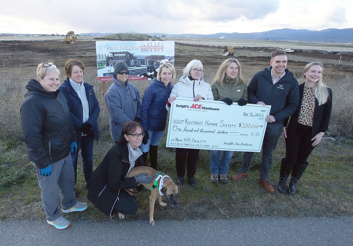 Brett Seright, CEO of Seright’s Ace Hardware, and wife Hanna, far right, present a $100,000 check to the Kootenai Humane Society on Tuesday. They are joined by, from left Denise Morris, Kelly Gill, Jadyn Loedding, Vicky Nelson and Cooper, Sally Ellingsen, Debbie Jeffrey, and Cindy Edington.