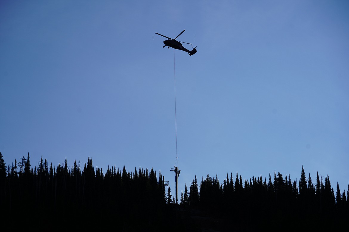 A helicopter was used to relocate the towers of Chair 8, which serves the Hellroaring Basin at Whitefish Mountain Resort. (Courtesy of Whitefish Mountain Resort)