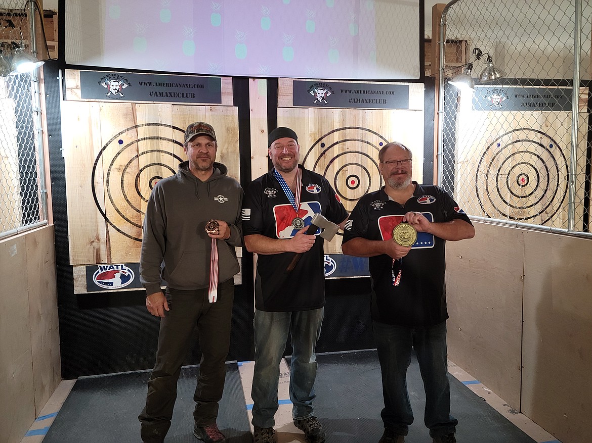 Owner Jimmy Garrey, center, with other ax-throwers at American Axe Throwing after a competition in early November. (courtesy photo)