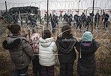 Belarus brings some migrants at Polish border in from cold