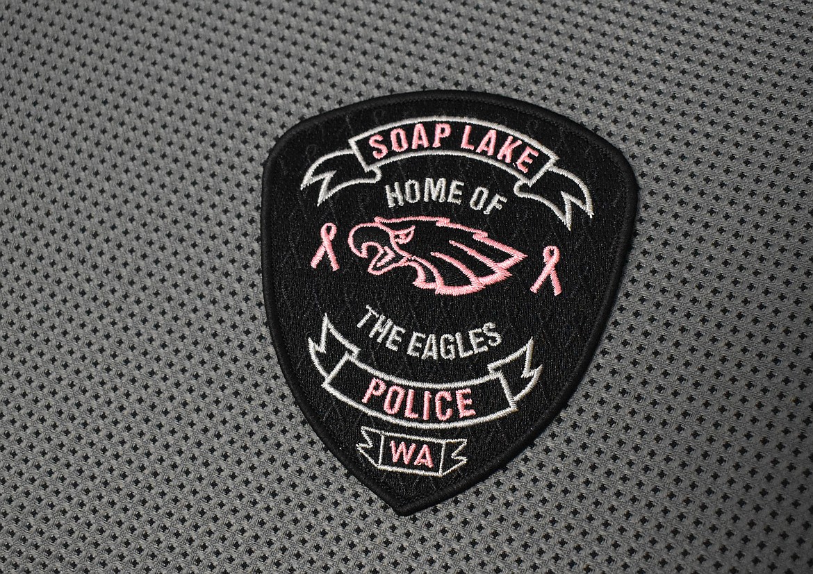 The patch Soap Lake Police Department sold for Breast Cancer Awareness Month has the same logo and size as its officer’s patches, only this patch features pink embroidery and pink breast cancer ribbons on both sides of the eagle.
