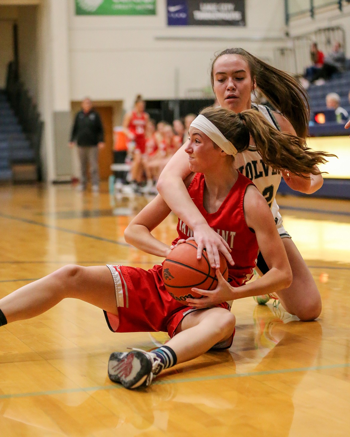 Junior Anna Reinink gets down on the floor to gain possession of the ball Thursday.