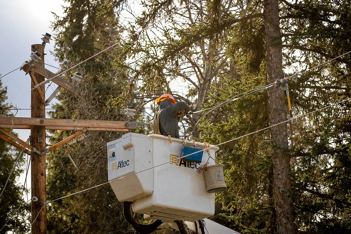 A Flathead Electric Cooperative crew works on a power line following a wind storm earlier this week. (Photo courtesy of Flathead Electric Cooperative)