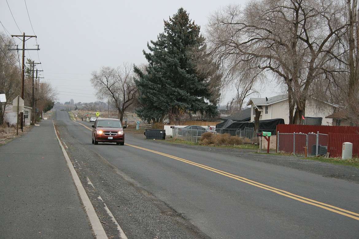 A vehicle heads west on Maple Drive Northeast in Moses Lake on Thursday.