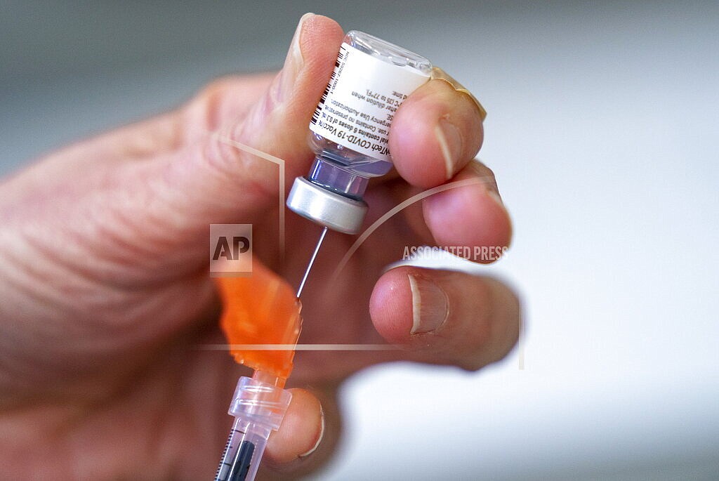 A syringe is loaded with the Pfizer COVID-19 vaccine at a clinic in Richmond, British Columbia, Canada on April 10, 2021. Canada’s health regulator has approved Pfizer’s kid-size COVID-19 shot, Friday, Nov. 19. (Jonathan Hayward/The Canadian Press via AP, File)