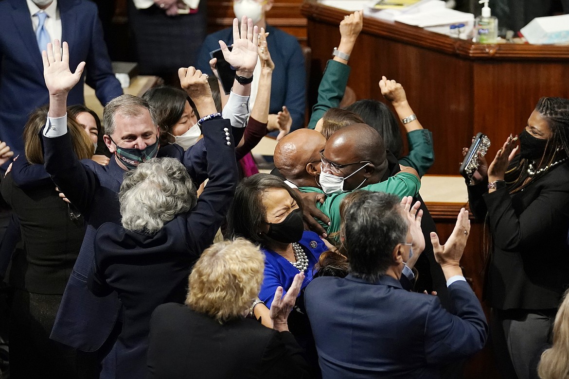 House Democrats celebrate after the House passage of President Joe Biden's expansive social and environment bill, at the Capitol in Washington, Friday, Nov. 19, 2021. (AP Photo/J. Scott Applewhite)