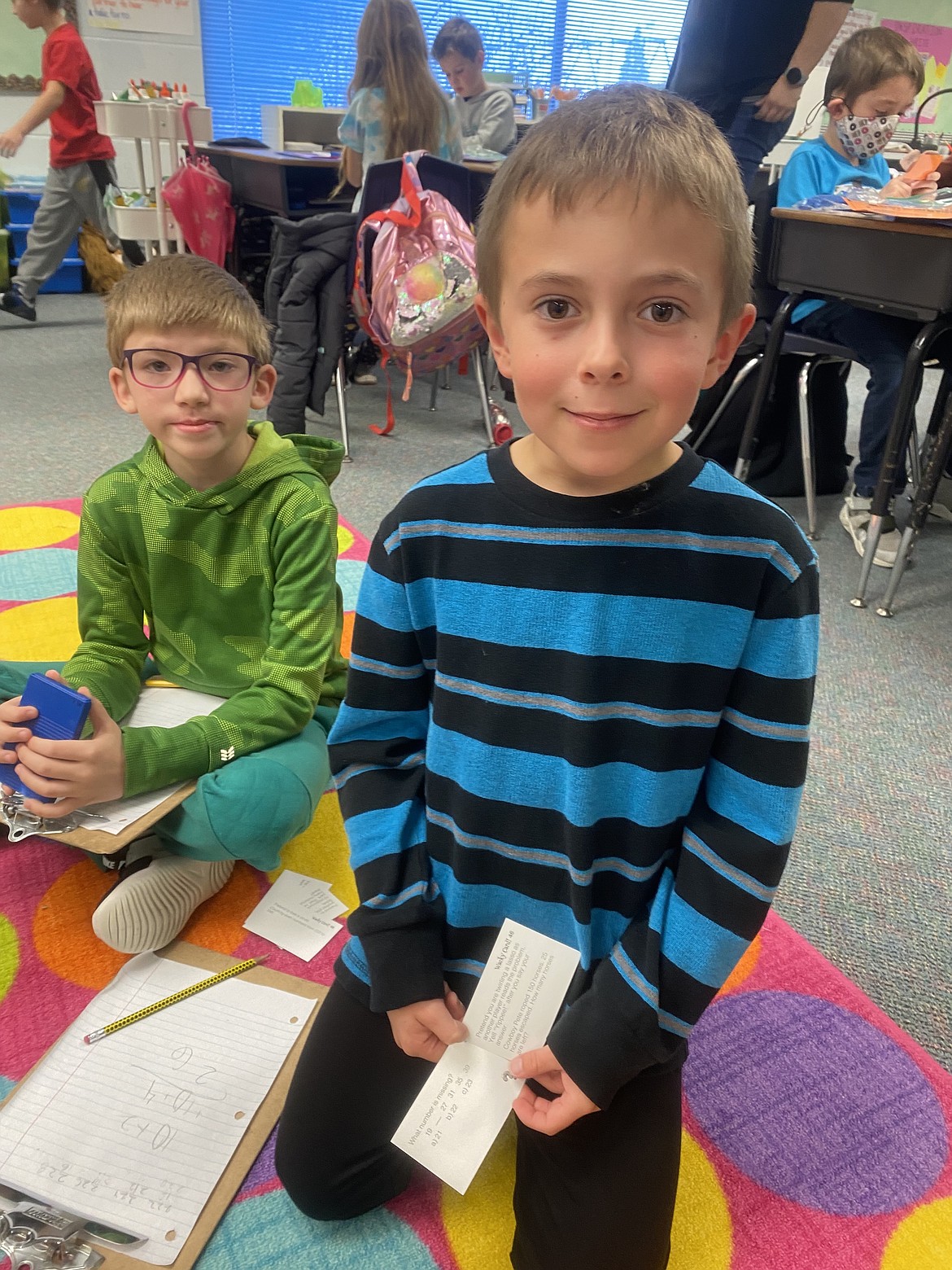 Second grade students, Everett Lohman, left, and Asher Grant play 'Math Noodles' Friday morning. A grant from the Post Falls Education Foundation made possible a new selection of innovative math games for teacher Sarah Triphahn's classroom.