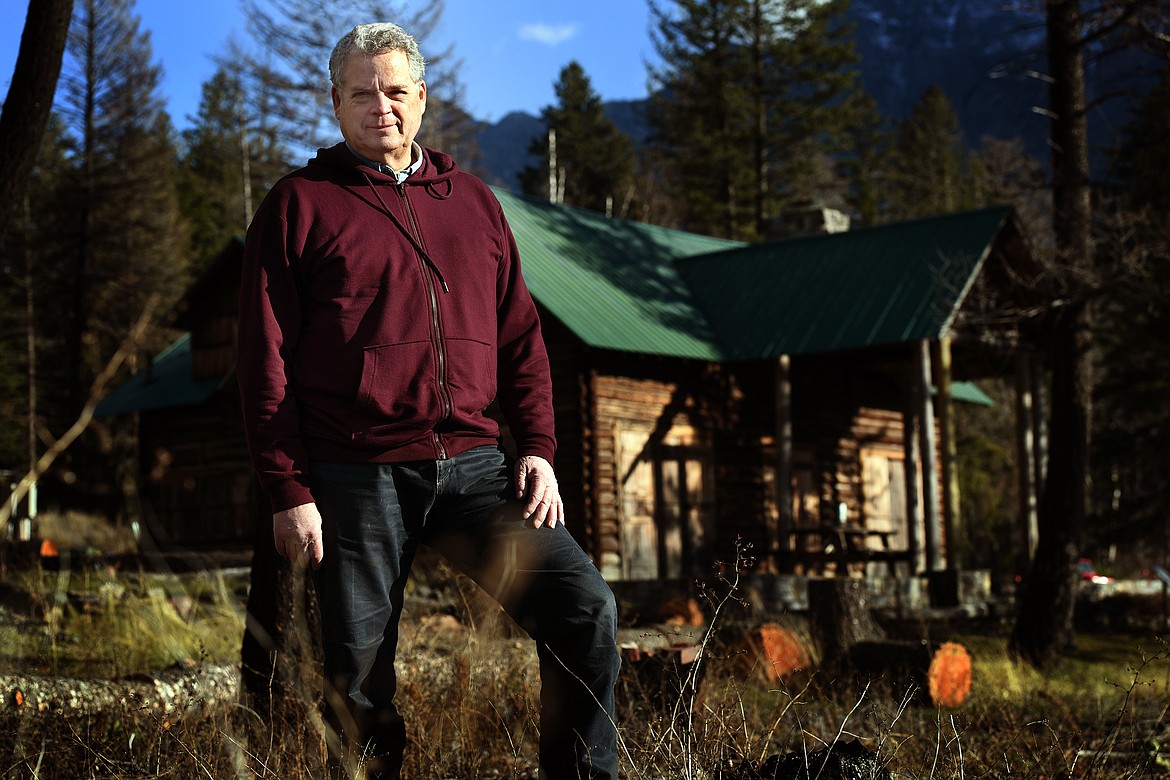 Glacier National Park historical architect Kim Hyatt stands in front of the Wheeler Cabin on the shore of McDonald Lake Nov. 17. Hyatt is in charge of preserving the more than 700 historical buildings and structures inside the park. (Jeremy Weber/Daily Inter Lake)