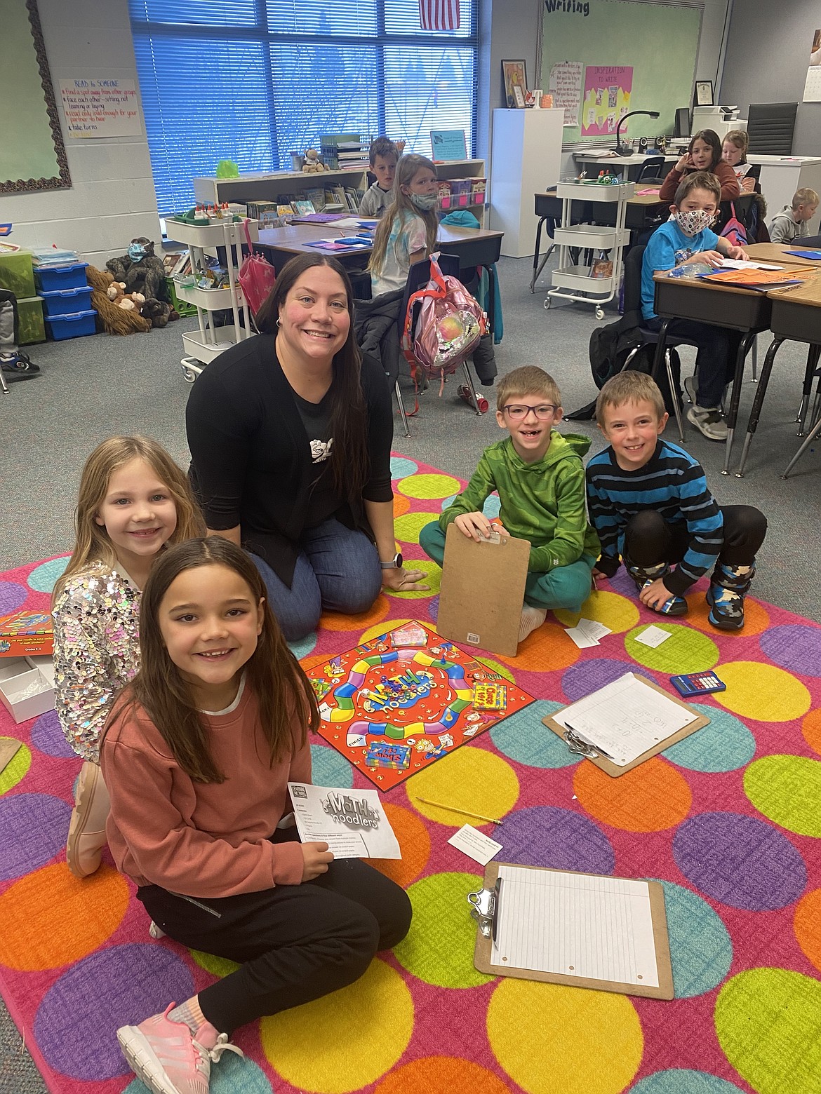Friday at Prairie View Elementary School, second grade teacher Sarah Triphahn, center, sits with her students, from left: June Laos, Lavender Lepley, Everett Lohmon and Asher Grant.