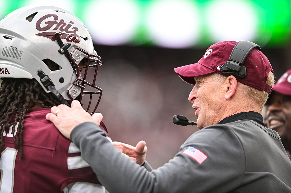 Montana head coach Bobby Hauck talks with cornerback Justin Ford (21) as they play Montana State during the 120th Brawl of the Wild at Washington-Grizzly Stadium on Saturday, Nov. 20. (Casey Kreider/Daily Inter Lake)