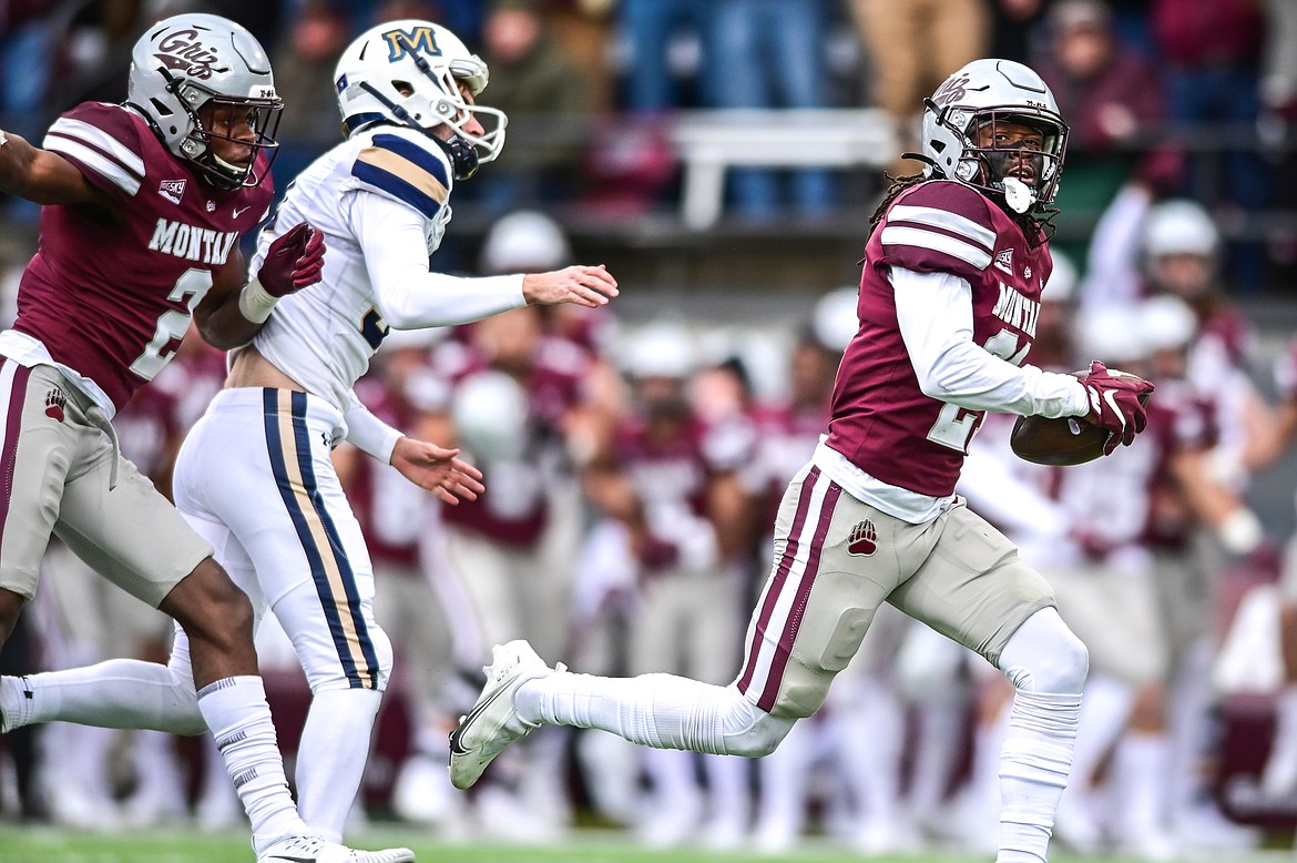 Montana cornerback Justin Ford (21) returns a fumble 56-yards for a touchdown after a fake field goal attempt by Montana State during the 120th Brawl of the Wild at Washington-Grizzly Stadium on Saturday, Nov. 20. (Casey Kreider/Daily Inter Lake)