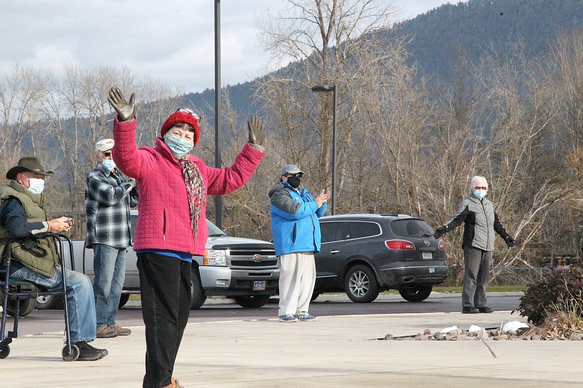 Supporters of Cabinet Peaks Medical Center staff clap and cheer after lining up outside of the building on Nov. 20 to give the center a "hug." (Will Langhorne/The Western News)