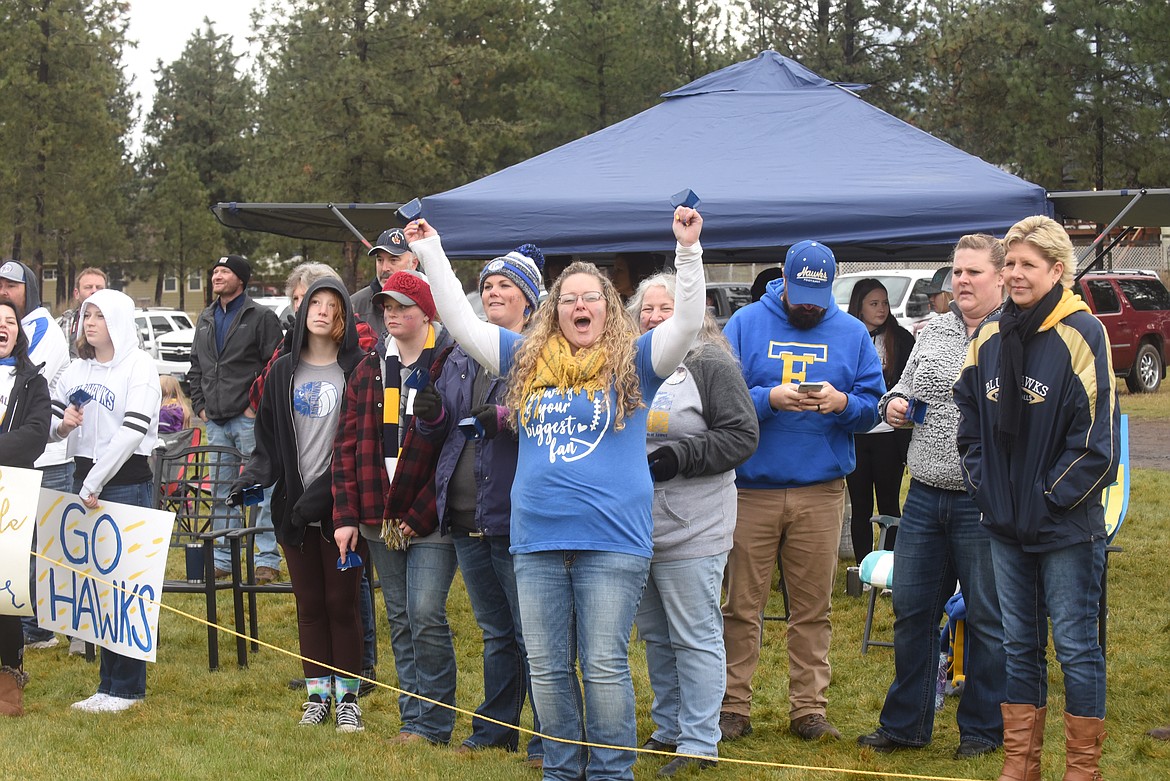 A Thompson Falls fan celebrates a Blue Hawks touchdown in the first half of last week’s 8-man title game. (Scott Shindledecker/Valley Press)