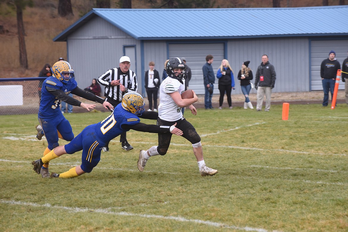 Thompson Falls sophomore Hayden Hanks trips up a Flint Creek ball carrier for a big loss during last Saturday’s 8-man title game. (Scott Shindledecker/Valley Press)