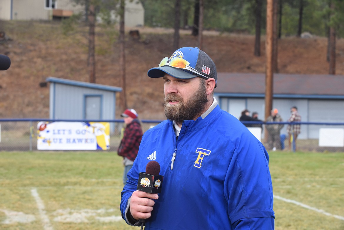 Thompson Falls head coach Jared Koskela does a media interview after his team won the Montana 2021 8-man football championship. (Scott Shindledecker/Valley Press)