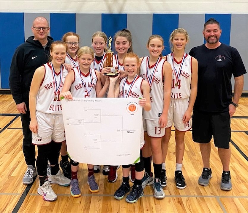 The North Idaho Elite seventh-grade girls basketball team went undefeated and placed first in the River City Tournament on Nov. 12-14 in Post Falls. Jordyn Tomco, a Sandpoint Middle School seventh grader, is on the team. Front row (from left): Macie Zimmerman, Ashley Yates and Chloe Murphree. Back row (from left): coach Eli Yates, Madison Zimmerman, Molly Carroll, Savoy Sternberg, Jordyn Tomco, Ella Pearson and coach Justin Sternberg.