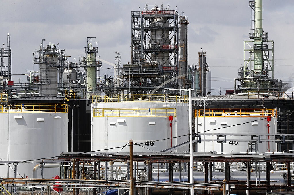 Storage tanks are shown at a refinery in Detroit, Tuesday, April 21, 2020. The White House on Tuesday said it had ordered 50 million barrels of oil released from strategic reserve to bring down energy costs. (AP Photo/Paul Sancya, File)