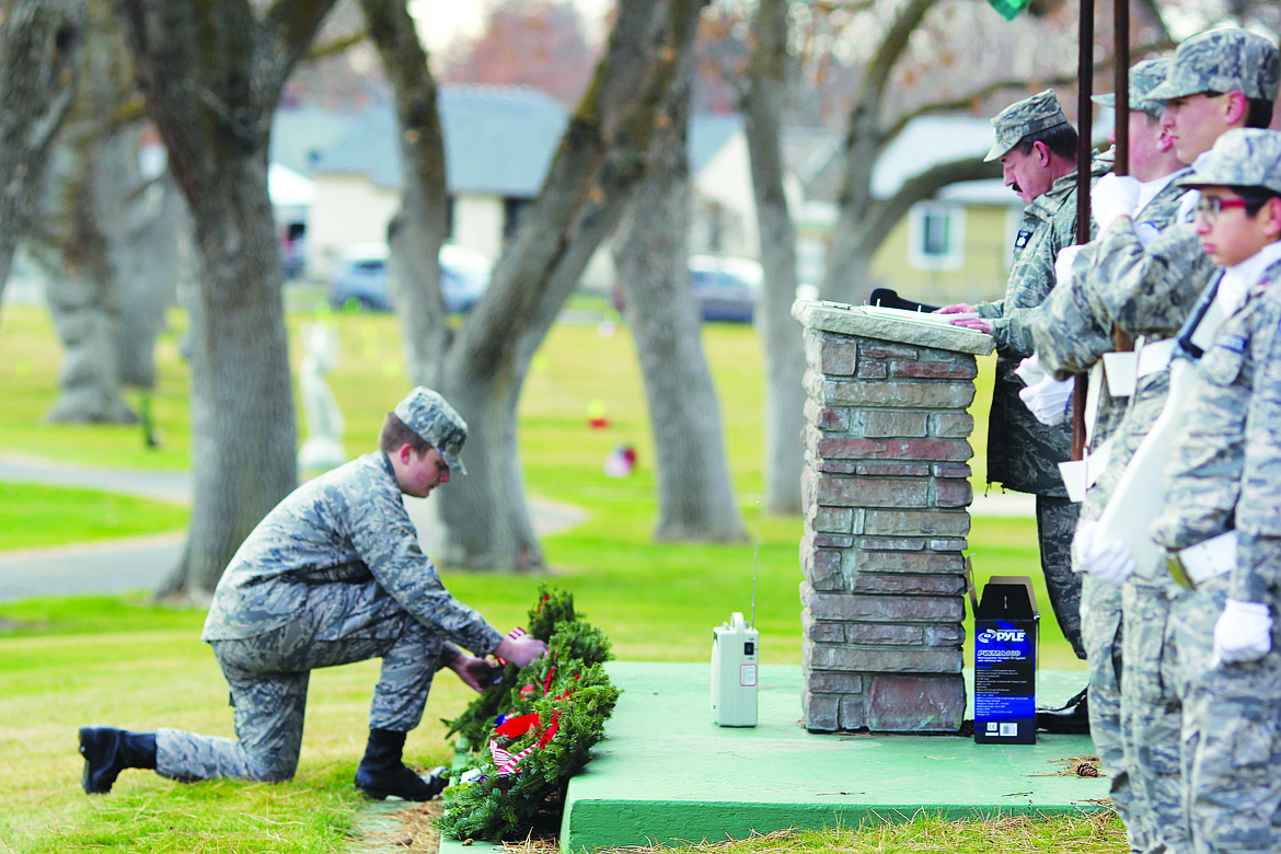 A cadet places a wreath as part of Wreaths Across America in 2018. This year’s event is Dec. 18.