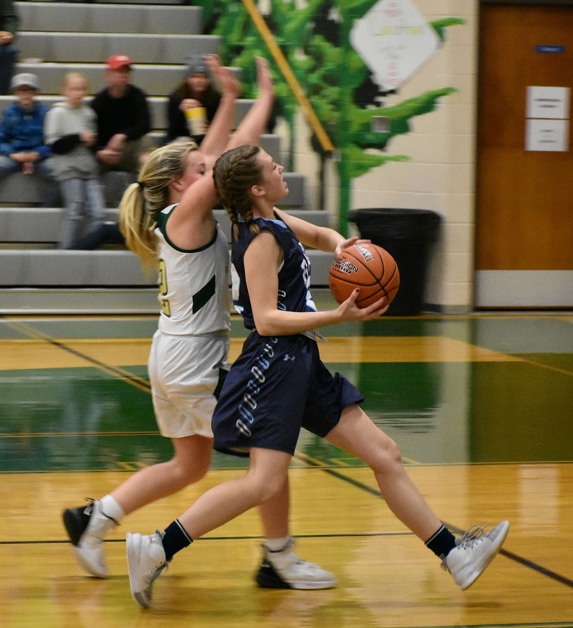 Rylie Kimball driving the ball to the hoop.