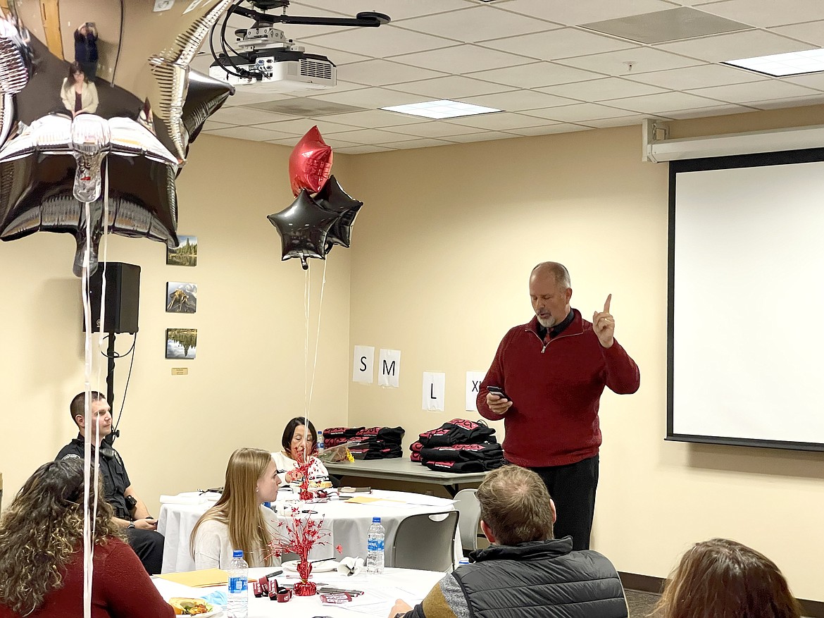 North Idaho College Vice President of Student Services Graydon Stanley reads an inspirational quote to students who completed NIC’s new Cardinal Peer Advocates program this fall. Photo courtesy of North Idaho College