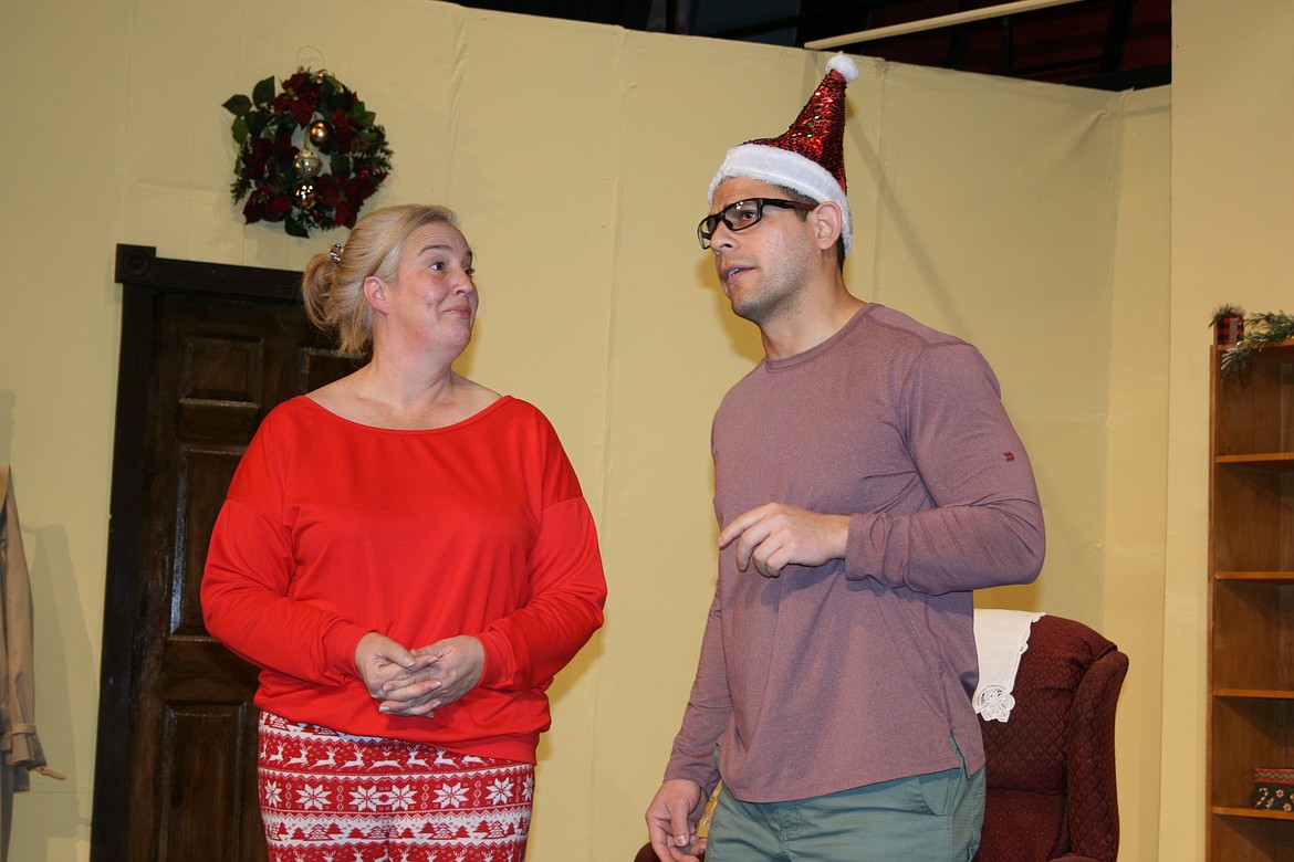 Nora (Carrie Rutherford, left) tries to make Dwain (Lui Navarro, right) feel at ease in the Masquers Theater production of “Sleeping Indoors.” The production opens Dec. 3.