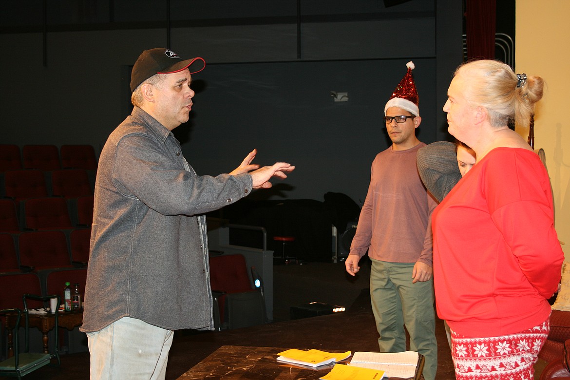 Assistant director Pat Rosman (left) works with cast members Lui Navarro (center back) and Carrie Rutherford (right) during rehearsal for “Sleeping Indoors,” the Masquers Theater production opening Dec. 3.