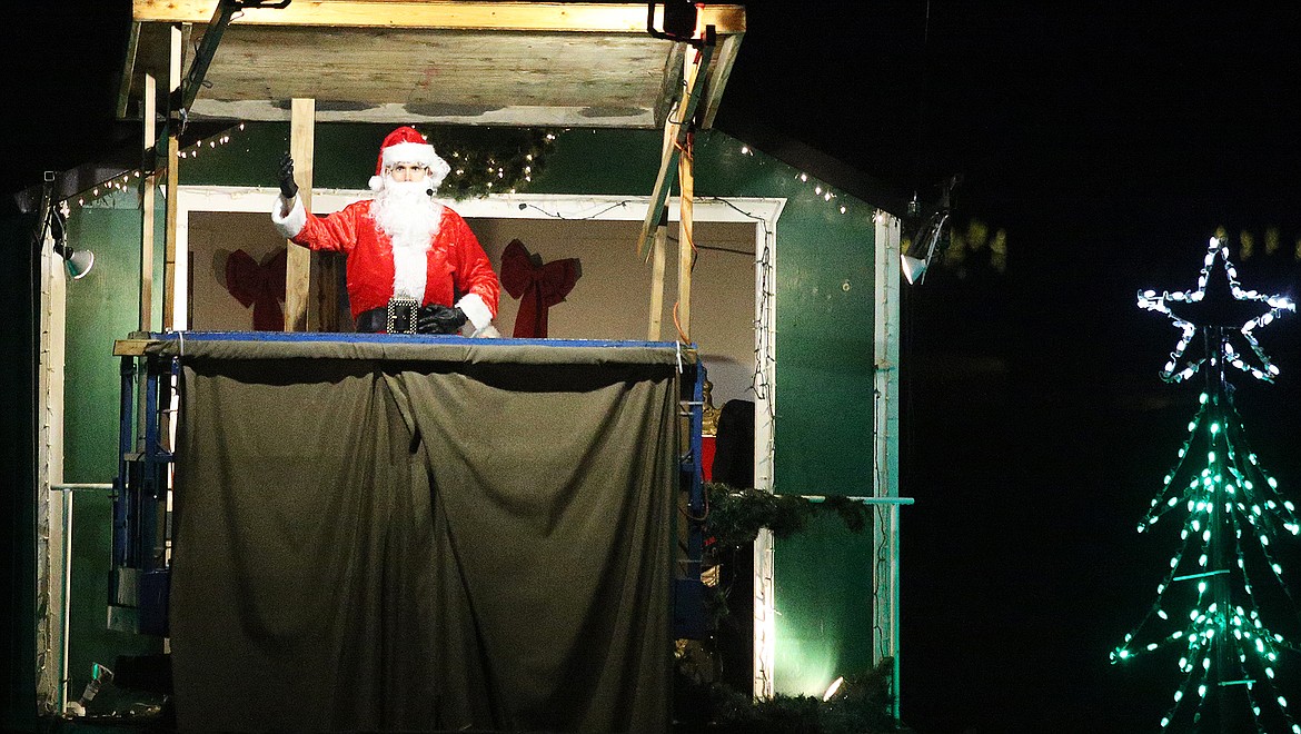 Santa Claus greets visitors at the North Pole during a cruise across Lake Coeur d’Alene from The Coeur d’Alene Resort Tuesday night. The Resort’s Holiday Light Show is in its 35th year.