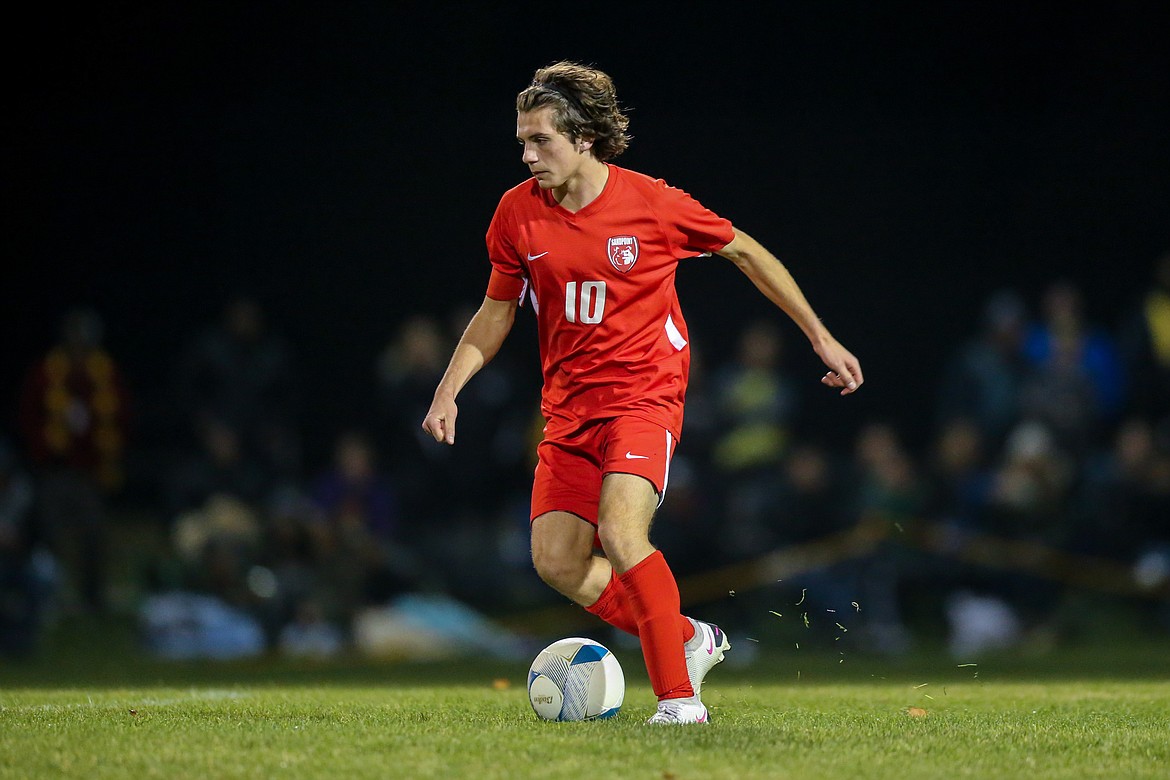 Senior Nolan Angell dribbles the ball upfield during the 4A state championship against Bishop Kelly on Oct. 23. He grabbed first-team all-state honors.