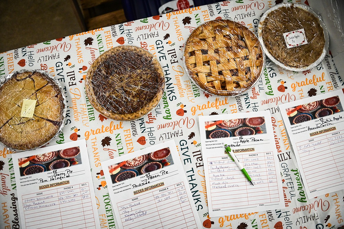 Pies and bidding sheets at Light Up Evergreen & Pie Auction at The Hardware Store on Tuesday, Nov. 23. (Casey Kreider/Daily Inter Lake)