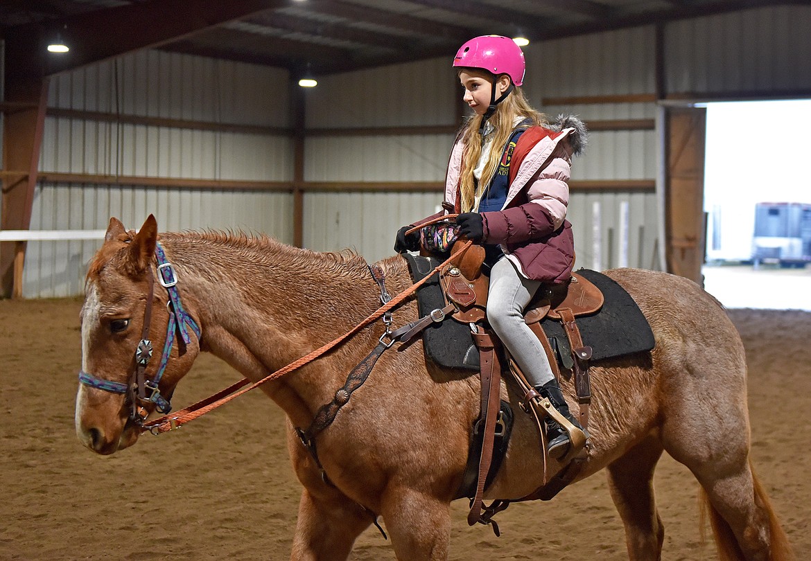 Whitefish Christian Academy sixth grade student Madison Erickson learns to ride a horse at Lost Creek Ranch as part of the school's Horsemanship Program on Friday, Nov. 12. (Whitney England/Whitefish Pilot)